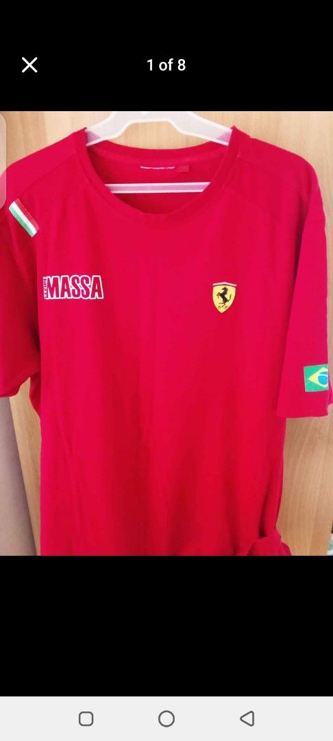 Ferrari Massa T-shirt Red (Category: Tshirts & Polo Shirts ) located in Manila. Submitted by jef09754 (Listing ID 1460376797, Image 1). Description: - Red t-shirt featuring Massa and Ferrari logos - Italian flag on one sleeve, Brazilian flag on the other - Ideal for Formula 1 enthusiasts - Show your support for Felipe Massa and Scuderia Ferrari - Great for casual wear.