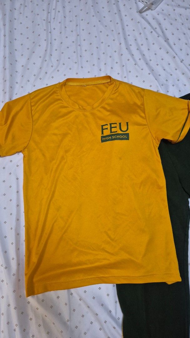 FEU High School PE UNIFORM (Category: Shirts) located in Manila. Submitted by warmhorse.d4d533 (Listing ID 1460339936, Image 1). Description: - FEU High School yellow t-shirt - Short sleeves, crew neck - Ideal for PE or casual wear - Standard school uniform style.