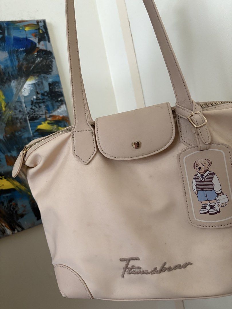 Fils Bear Tote Bag - Light Pink (Category: Tote Bags) located in Manila. Submitted by z.finds (Listing ID 1460363843, Image 1). Description: - Cute light pink tote bag - Features adorable Fils Bear design - Comes with a matching teddy bear luggage tag - Secure zipper closure - Ideal for everyday use.