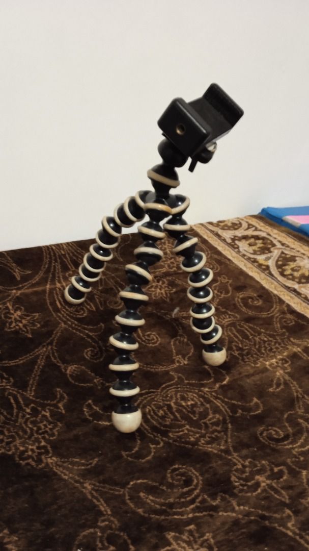 Flexible Gorilla Pod Tripod with Phone Mount (Category: Tripods & Monopods) located in Manila. Submitted by 1rom_sns (Listing ID 1460344452, Image 1). Description: - Flexible tripod for phones and small cameras - Legs bend and twist to securely grip various surfaces - Comes with a phone holder attachment - Ideal for stable vlogging and photography - Great for hands-free viewing and easy positioning Lalamove pick up Abono Rider.