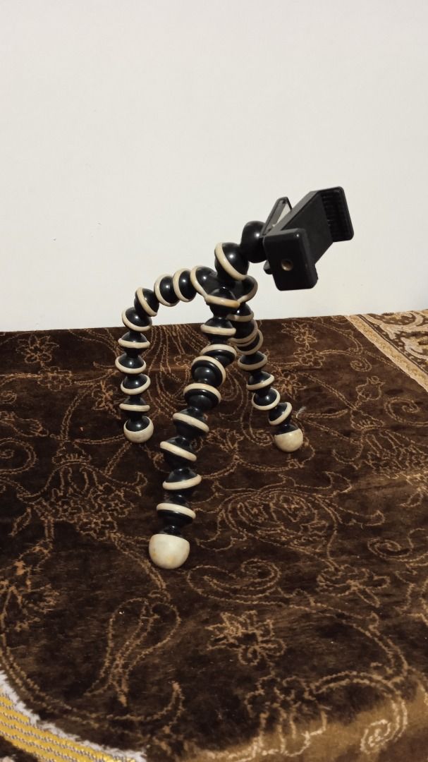 Flexible Gorilla Pod Tripod with Phone Mount (Category: Tripods & Monopods) located in Manila. Submitted by 1rom_sns (Listing ID 1460344452, Image 2). Description: - Flexible tripod for phones and small cameras - Legs bend and twist to securely grip various surfaces - Comes with a phone holder attachment - Ideal for stable vlogging and photography - Great for hands-free viewing and easy positioning Lalamove pick up Abono Rider.
