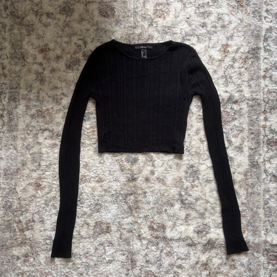 Forever 21 Black Ribbed Long Sleeve Crop Top (Category: Longsleeves) located in Pasig City. Submitted by mariannesnts (Listing ID 1460506449, Image 1). Description: - Forever 21 black ribbed long sleeve crop top - Crew neck design - Very stretchy material for a comfortable fit - Versatile: great for layering or wearing on its own - Pairs well with high-waisted bottoms.