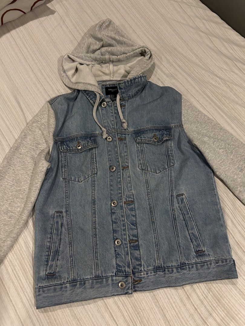 Forever 21 Denim Jacket (Category: Hoodies) located in Quezon City. Submitted by yaboiraf (Listing ID 1460447814, Image 2). Description: Forever 21 Denim Jacket Size large (22W 26L) Denim fabric/cotton hoodie and sleeves Personal item not thrifted Issue: yellow stain sa left sleeve but washable Good condition 900 Quezon City Lalamove or Jrs Express.