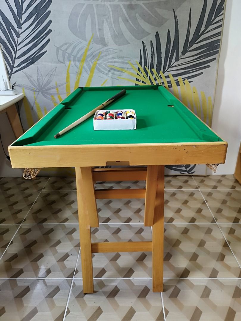 Freestanding Mini Wooden Billiard Table (Category: Billiards and Bowling) located in Santa Cruz. Submitted by jmy_surplus.2 (Listing ID 1460455469, Image 2). Description: Size ; L - 28 W - 48 H - 24 Color ; Green Type ; Billiard table Brand ; No brand Material ; Wood Style ; Green Felt Surface Billiard Table JMA JMY 5 Batch #218.