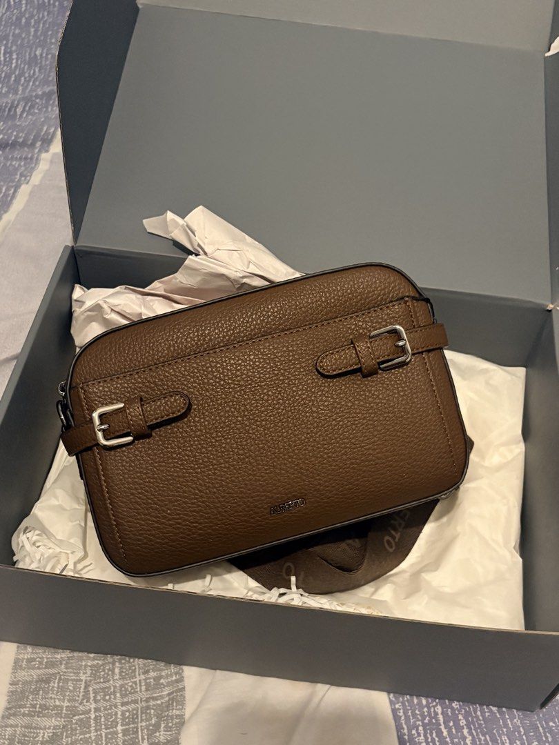 FS Brown Leather Sling Bag (Category: Sling Bags) located in Manila. Submitted by marlonestrllaa (Listing ID 1460332575, Image 1). Description: - Stylish brown tote bag - Durable canvas material - Spacious interior - Classic and versatile design.