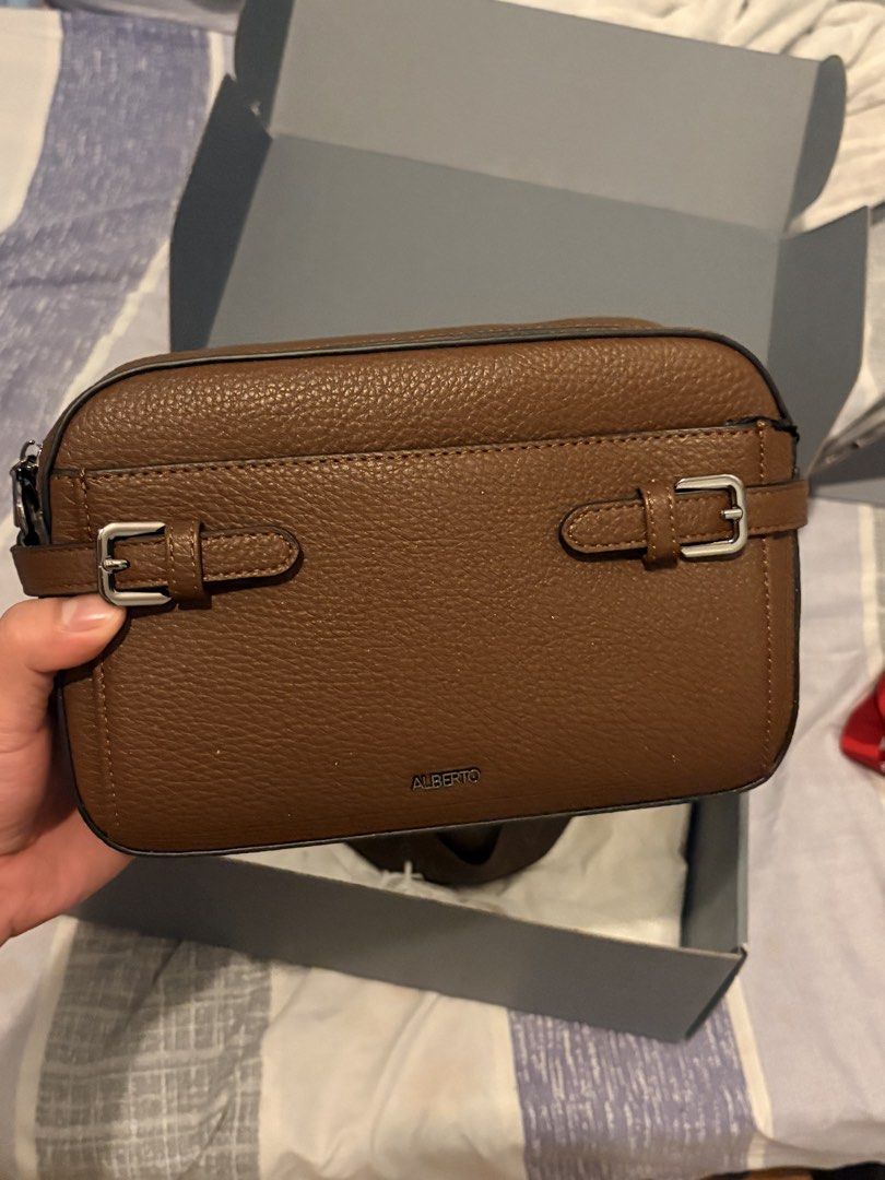 FS Brown Leather Sling Bag (Category: Sling Bags) located in Manila. Submitted by marlonestrllaa (Listing ID 1460332575, Image 3). Description: - Stylish brown tote bag - Durable canvas material - Spacious interior - Classic and versatile design.