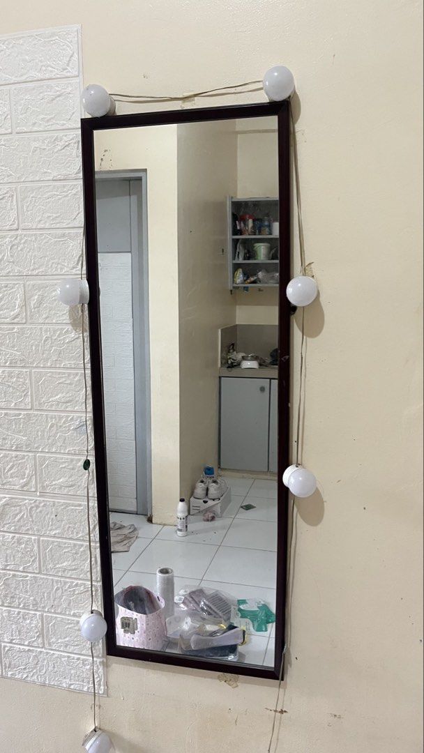 Full Length Mirror with Lights (Category: Mirrors) located in Manila. Submitted by jana0011 (Listing ID 1460308324, Image 1). Description: - Full length mirror - Dark brown frame - Attached string lights (plug-in) - Ideal for dressing or as a decor piece - Reflects room - Easy to place against a wall.