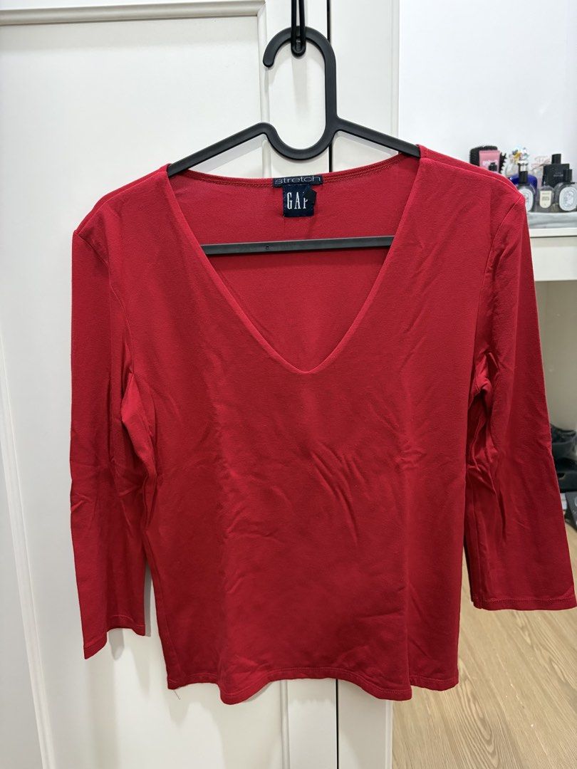 GAP Red V-Neck Stretch Top XS (Category: Sleeveless) located in Cavite. Submitted by kapekapekape (Listing ID 1460367993, Image 1). Description: - GAP Red V-neck Top - Comfortable stretch blend fabric - Three-quarter sleeves - Essential basic piece, easy to style - Measurements provided in photos Mode of Payment: Bank Transfer Shipping: J&T or Lalamove care of buyer.