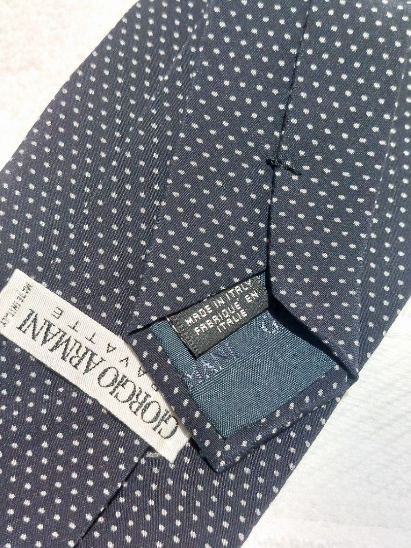 Giorgio Armani Necktie (Category: Luxury Accessories) located in Muntinlupa City. Submitted by sakurambo_des (Listing ID 1460476837, Image 3). Description: Giorgio Armani Cravatte Necktie Made in Italy 100%Silk fabric Color:Classic black background with a white micro-dot pattern. in very good condition..