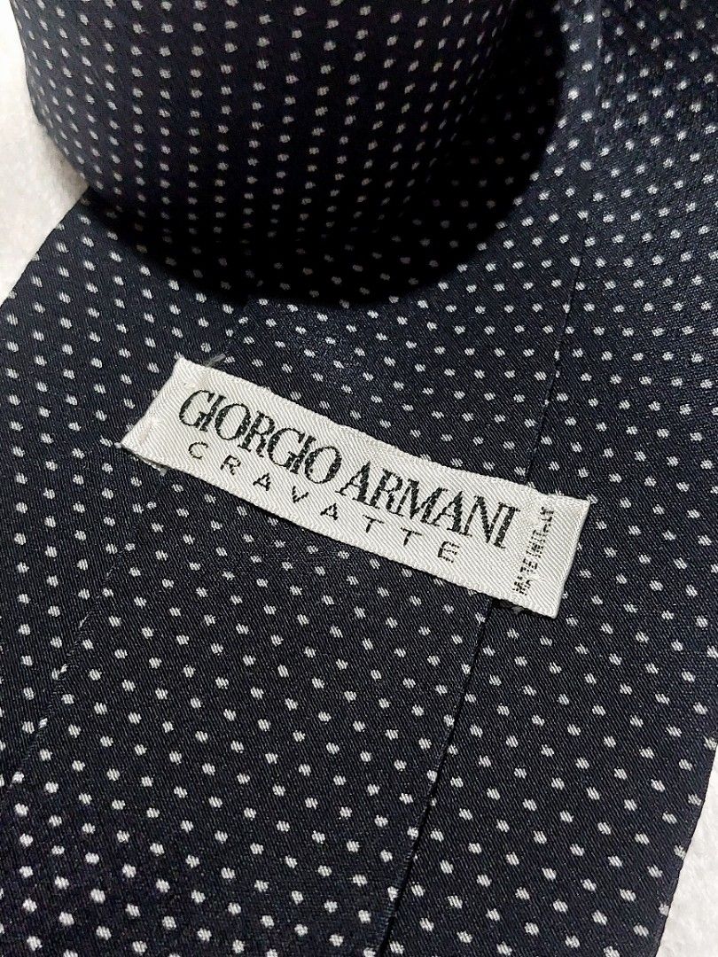 Giorgio Armani Necktie (Category: Luxury Accessories) located in Muntinlupa City. Submitted by sakurambo_des (Listing ID 1460476837, Image 2). Description: Giorgio Armani Cravatte Necktie Made in Italy 100%Silk fabric Color:Classic black background with a white micro-dot pattern. in very good condition..