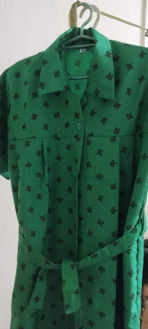 Girl Scouting uniform - Size XL (Category: Dresses) located in Makati City. Submitted by marizelsclosetdeclutter (Listing ID 1460305469, Image 2). Description: - Adorable green dress with a charming black bow print all over. - Features short sleeves and a classic collared neckline. - Includes a matching belt to beautifully cinch your waist. - Convenient button-up front for easy wear. - Size XL, ideal for a comfortable and stylish fit. - Perfect f