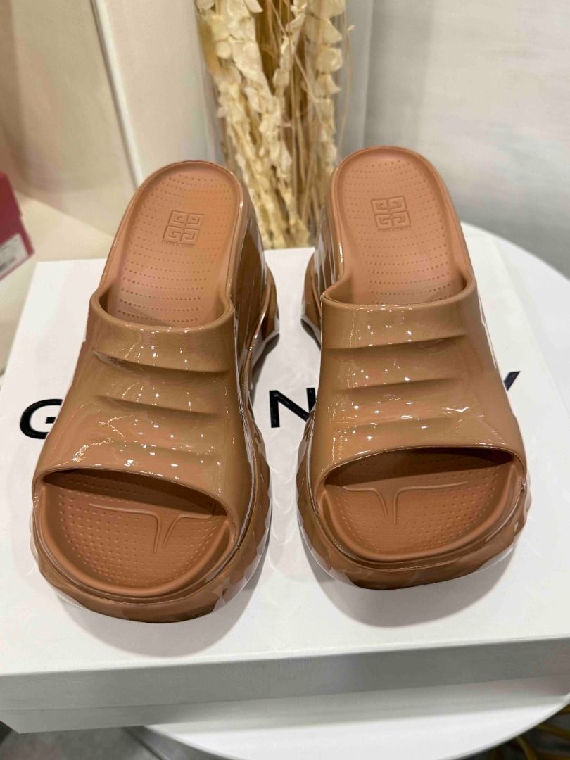 Givenchy Beige Patent Leather Wedge Slides (Category: Sneakers & Footwear) located in Las Pinas. Submitted by happystar_cac724 (Listing ID 1460396311, Image 1). Description: Givenchy marshmallow sandals size 40 Original Price Php 40,500 sale price 16k Brand new.