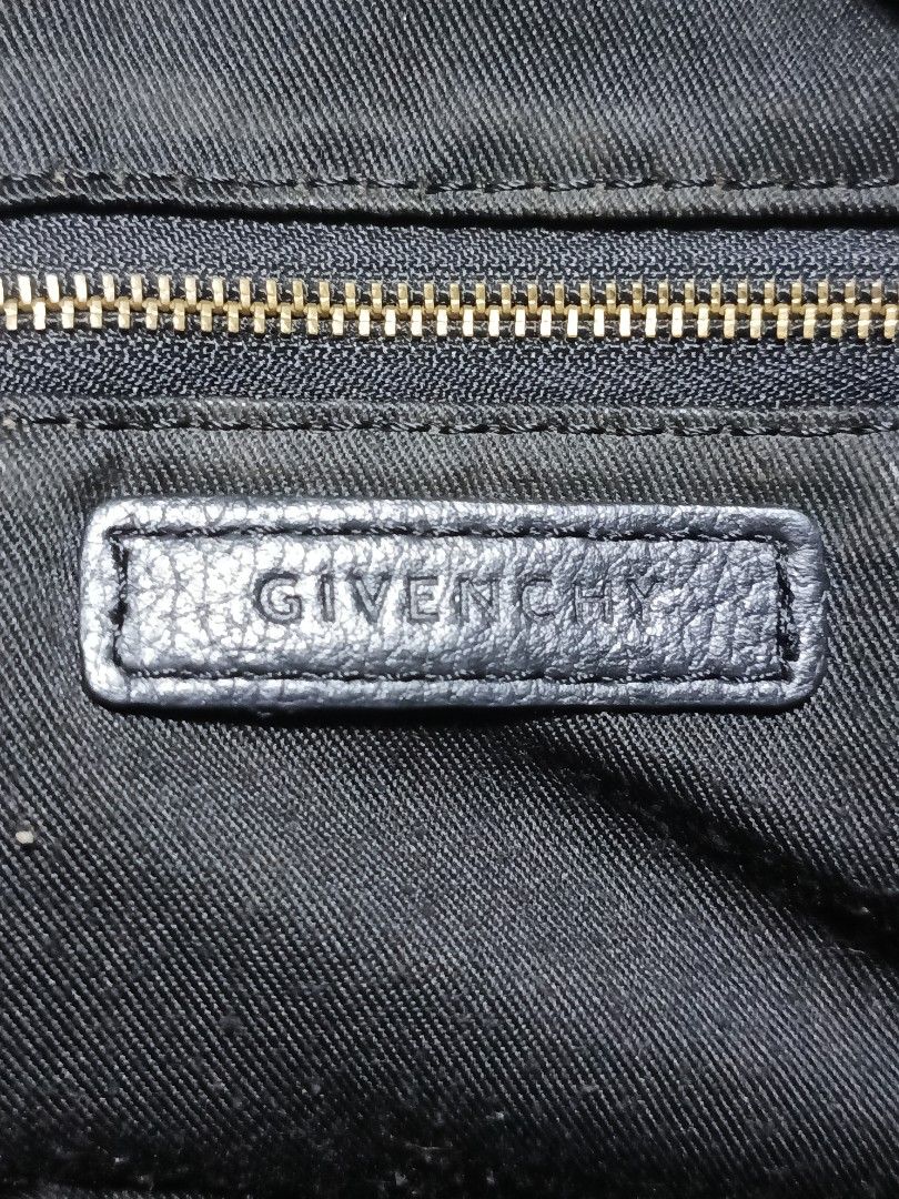 Givenchy Black Leather Tote Bag (Category: Luxury Bags & Wallets) located in Lucena. Submitted by jeankristi73450 (Listing ID 1460407400, Image 3). Description: - Givenchy black leather tote bag - removed sling slot - needs cleaning - Elegant gold-tone hardware - Secure zip closure - Luxurious fabric lining - Made in Italy - Dimensions: Approx. 13" (W) x 9" (H) x 6" (D) - Handle drop: Approx. 5".