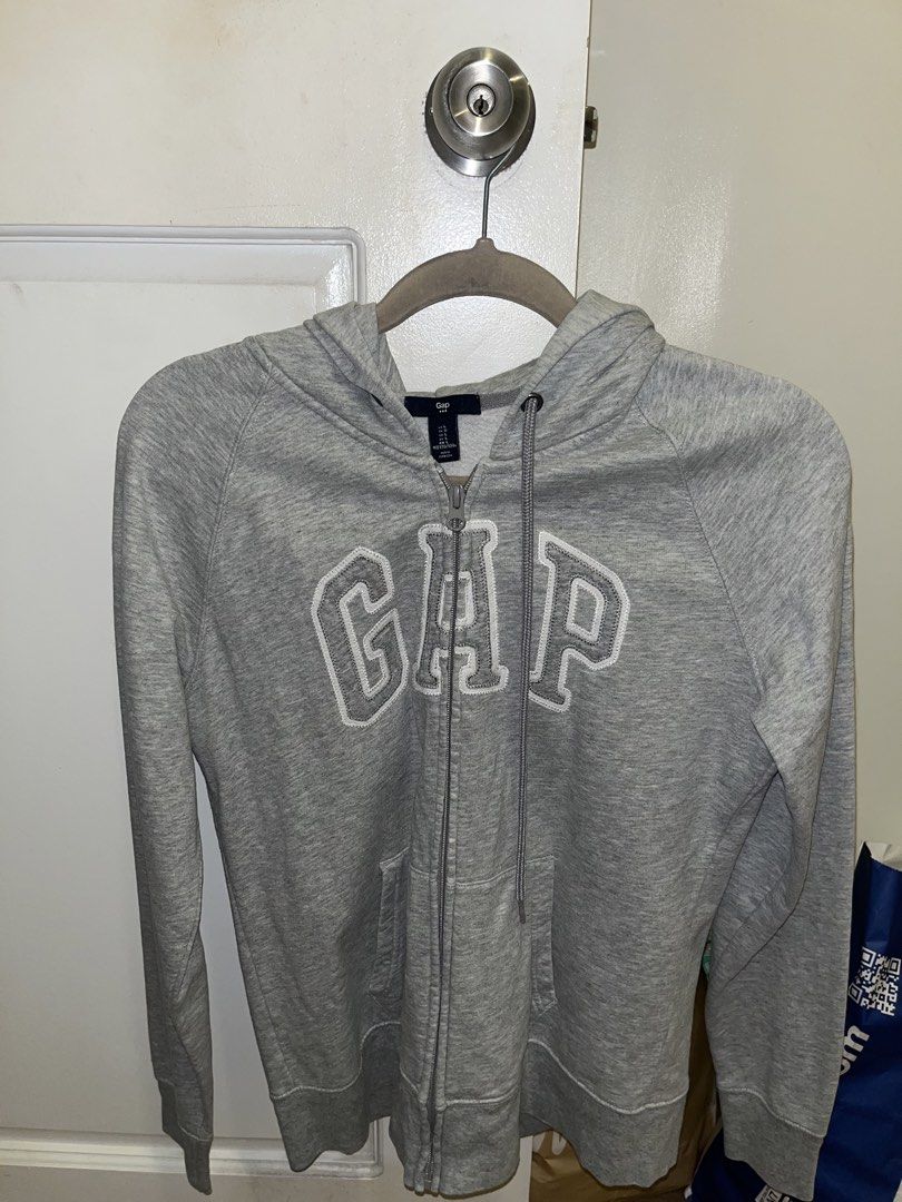 Grey Gap Zip-Up Hoodie (Category: Coats, Jackets and Outerwear) located in Paranaque City. Submitted by kalattt (Listing ID 1460401262, Image 1). Description: - Classic grey Gap hoodie - Full zip closure - Raglan sleeves - Embroidered Gap logo on front - Made in Cambodia - Ideal for everyday wear.