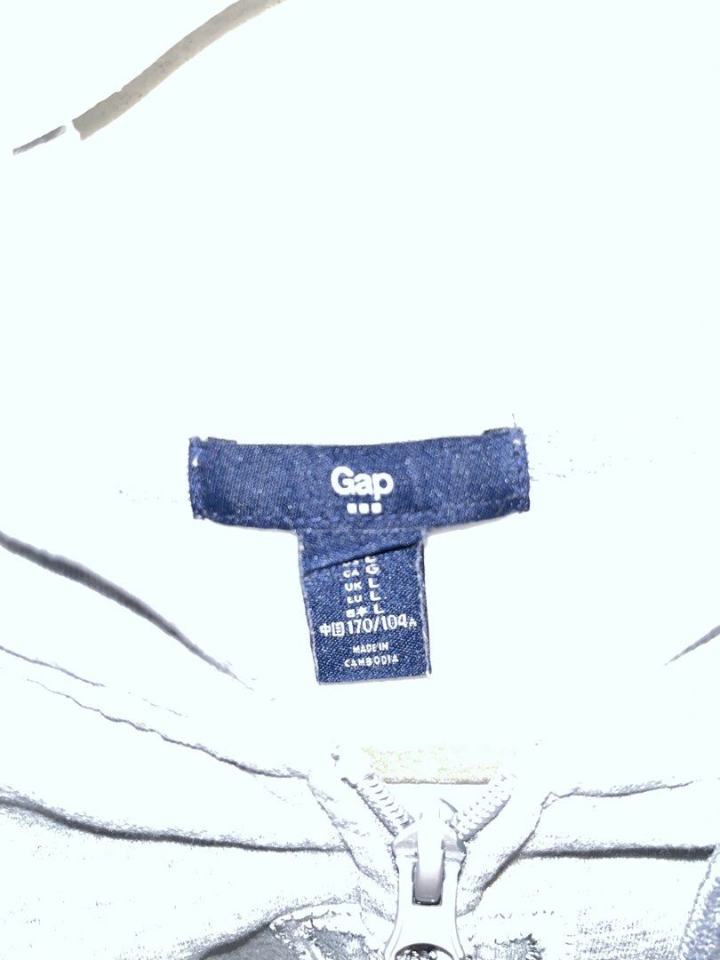 Grey Gap Zip-Up Hoodie (Category: Coats, Jackets and Outerwear) located in Paranaque City. Submitted by kalattt (Listing ID 1460401262, Image 2). Description: - Classic grey Gap hoodie - Full zip closure - Raglan sleeves - Embroidered Gap logo on front - Made in Cambodia - Ideal for everyday wear.