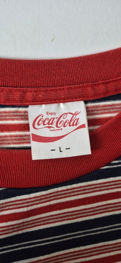 GU Coca-Cola Striped T-Shirt (Category: Tshirts & Polo Shirts ) located in Taguig. Submitted by regimennn (Listing ID 1460478836, Image 2). Description: - GU x Coca-Cola collaboration t-shirt - Classic red, navy, and white stripes - Red collar detail for a pop of color - Size Large (L) 22 x25 Negotiable and free shipping.