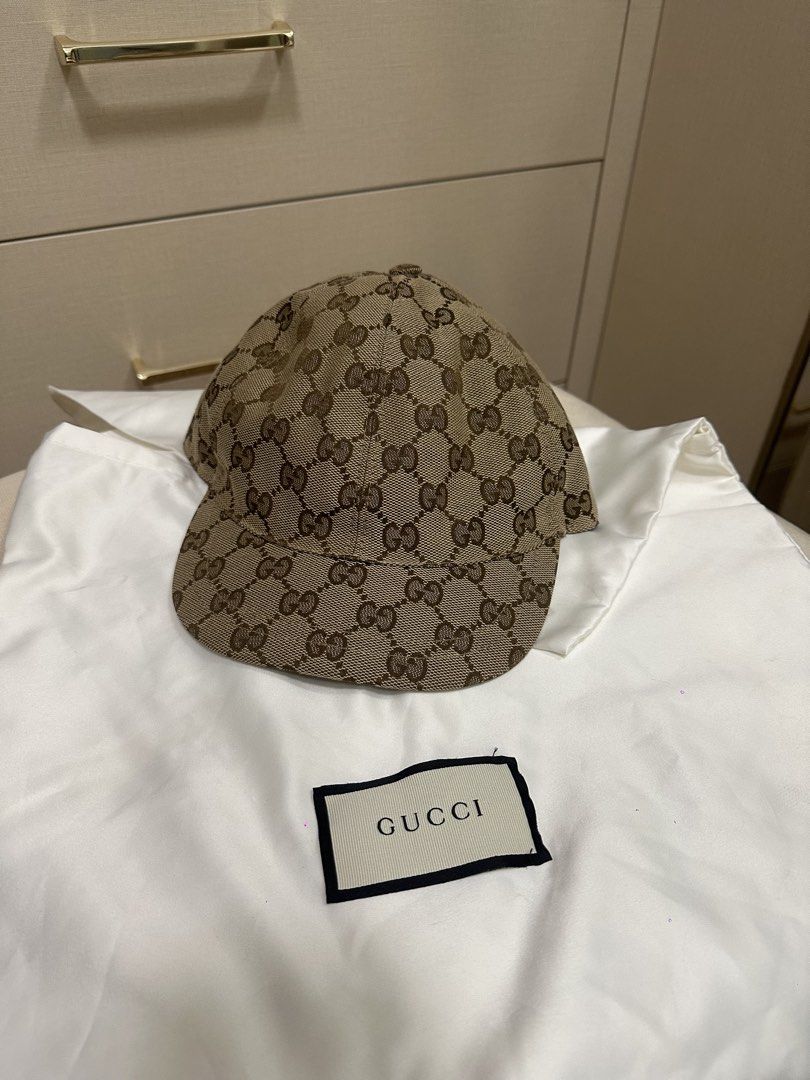 Gucci GG Monogram Baseball Cap for kids/teens (Category: Caps & Hats) located in Quezon City. Submitted by jennbustillos (Listing ID 1460459369, Image 1). Description: - Authentic Gucci Cap - Classic GG Monogram Canvas - Iconic Red and Green Stripe Detail (inside) - Size: M (54cm) - Comes with Gucci Dust Bag - Ideal for Everyday Wear.