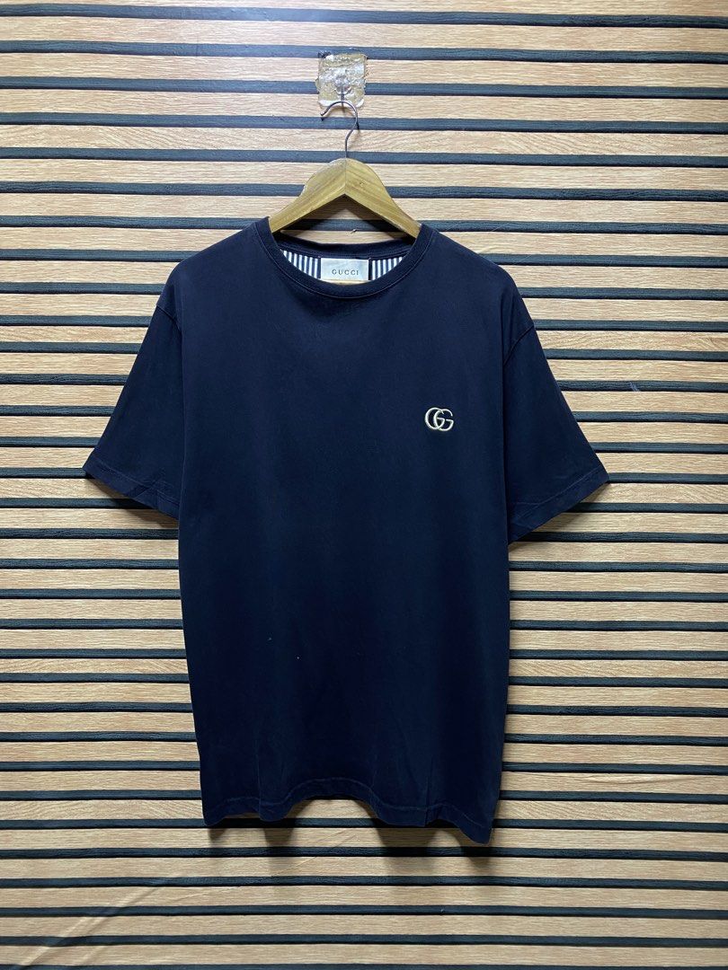 GUCCI “GG” TEE (Category: Tshirts & Polo Shirts ) located in Makati City. Submitted by drip.poww (Listing ID 1460444515, Image 1). Description: - Authentic Gucci - Color: black - Size: Large - Dimes: 23x30 - Authentic - Excellent condition - Need wash, fresh from bale - Material: 100% Cotton Please don’t expect too much—these are thrifted (ukay) items. 😊 !!STILL NEGOTIABLE!!.