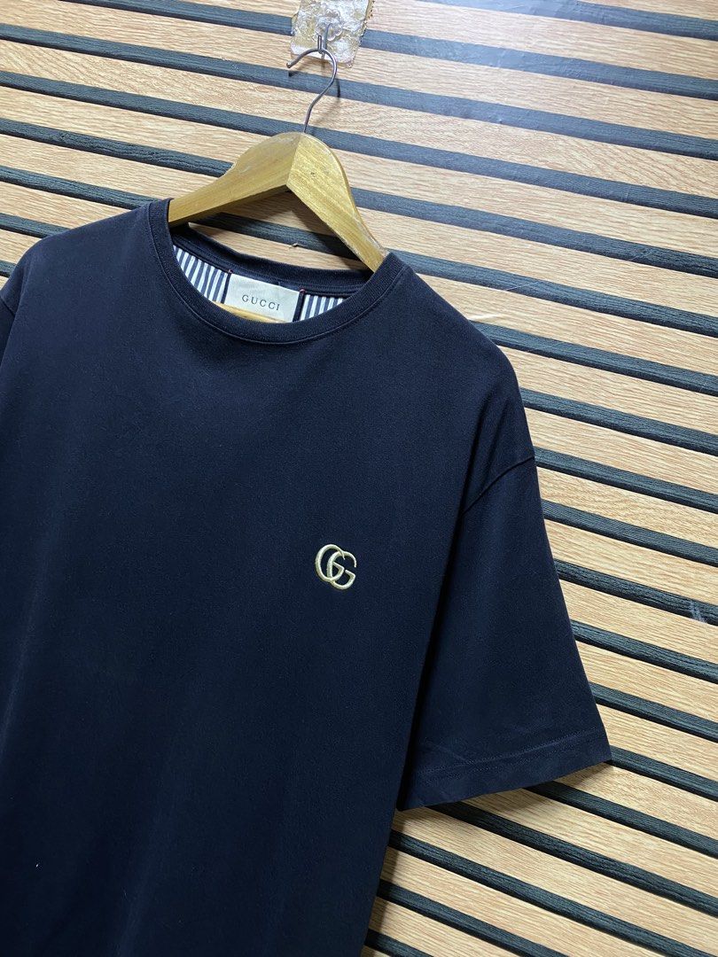 GUCCI “GG” TEE (Category: Tshirts & Polo Shirts ) located in Makati City. Submitted by drip.poww (Listing ID 1460444515, Image 3). Description: - Authentic Gucci - Color: black - Size: Large - Dimes: 23x30 - Authentic - Excellent condition - Need wash, fresh from bale - Material: 100% Cotton Please don’t expect too much—these are thrifted (ukay) items. 😊 !!STILL NEGOTIABLE!!.