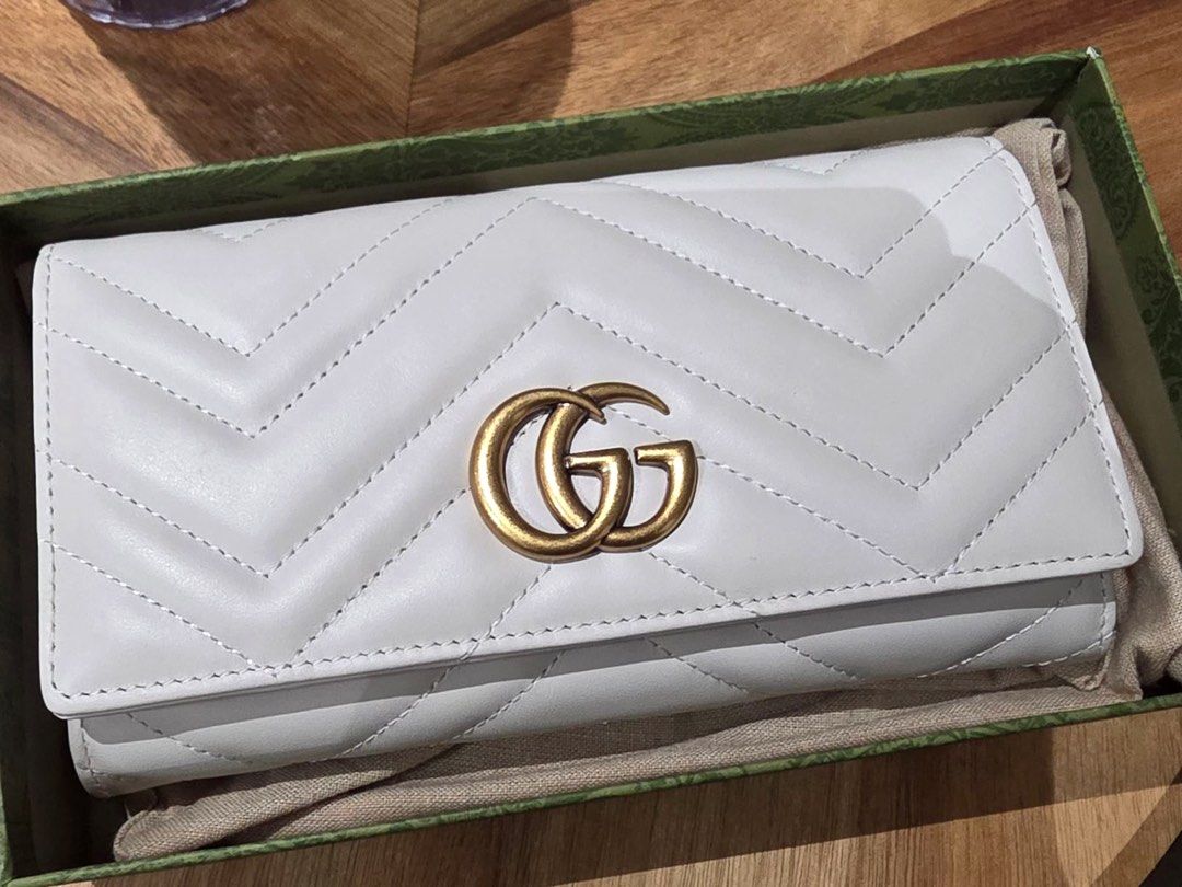 Gucci Marmont Continental Wallet (Category: Wallets & Card holders) located in Dasmarinas. Submitted by thebagdetox (Listing ID 1460412055, Image 1). Description: GUCCI MARMONT CONTINENTAL WALLET — WHITE 🤍 A timeless and elegant piece from Gucci’s iconic Marmont collection. The classic quilted design paired with the signature GG logo makes this wallet effortlessly chic and easy to style. The white colorway gives it a clean, sophisticated look—pe
