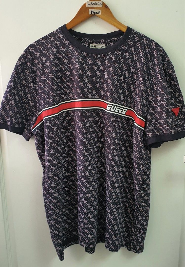 Guess All Over Print T-Shirt (Category: Tshirts & Polo Shirts ) located in Tarlac. Submitted by resaleclub (Listing ID 1460443511, Image 1). Description: - Guess all-over monogram print t-shirt - Features classic Guess logo across the chest - Red and white stripe detailing - Small red Guess triangle logo on the sleeve - Measurements: Width 23", Length 29" - please check photos for stain, discoloration, pinhole or mending. Bawal po sa maselan.