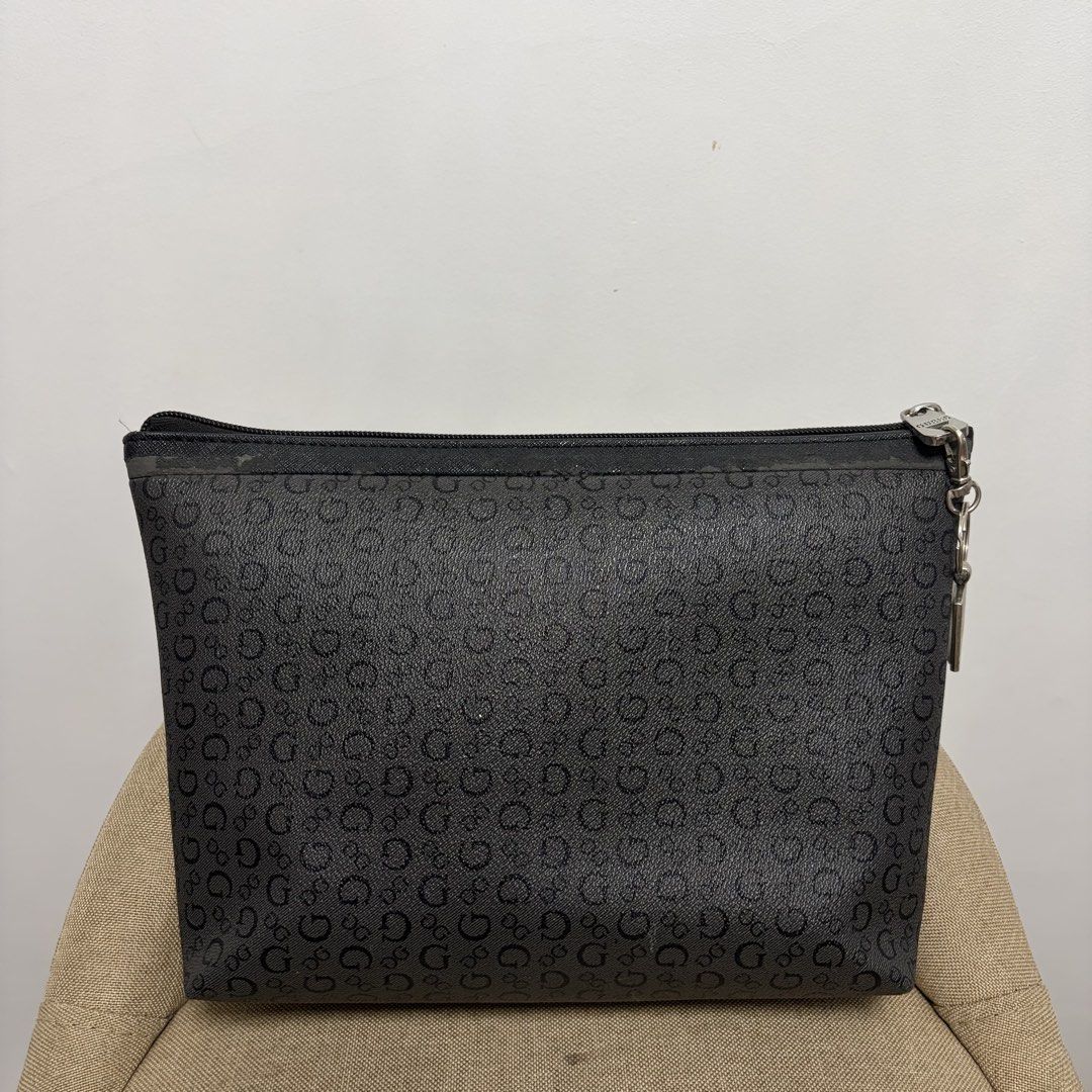 Guess black monogram pouch (Category: Belt bags, Clutches and Pouches) located in San Carlos. Submitted by marj.mco (Listing ID 1460436816, Image 2). Description: US bought Preloved With scratches (check photos) 100% original.