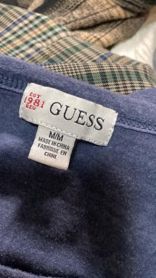 Guess Jeans Blue T-shirt with Sequins (Category: Shirts) located in Manila. Submitted by airamef28.closet (Listing ID 1460425328, Image 2). Description: - Blue Guess Jeans T-shirt - Size: Medium (M) - 'GUESS JEANS' detail in sparkling silver sequins across the chest - Classic short sleeves - Comfortable scoop neck - Made in China.