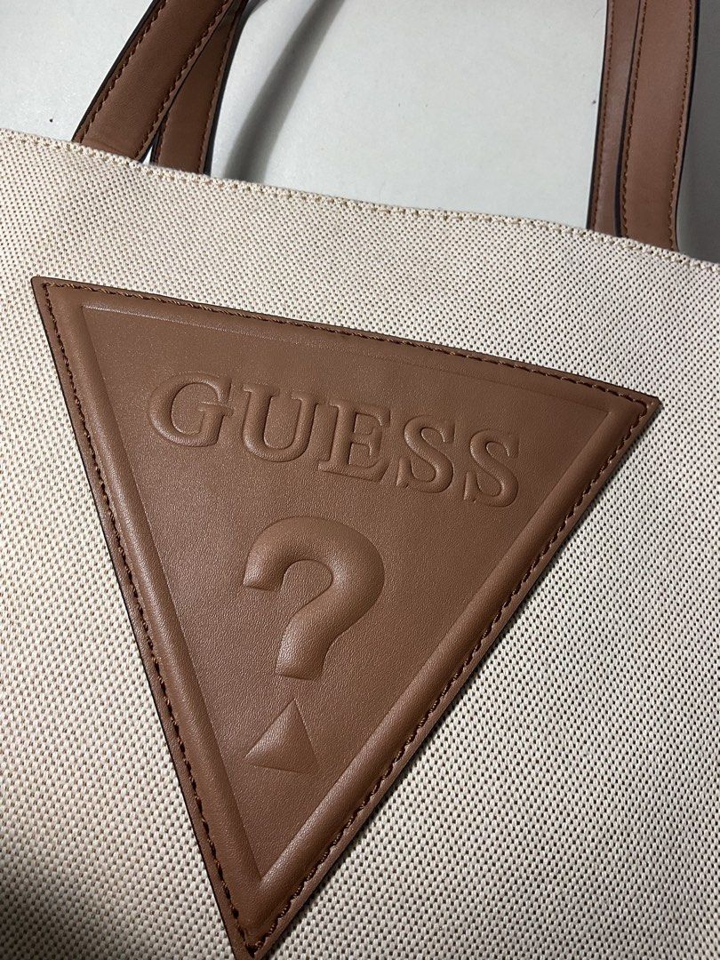 GUESS Panya Large Tote Bag (Category: Tote Bags) located in Manila. Submitted by declutterwgab (Listing ID 1460344106, Image 2). Description: ❗️Used once for a 2-unit class in school. Will sell because it does not fit everything I need for school (1 Laptop, 1 iPad, 1-2 thick books, pens, and paper 😅😂) ❗️100% Original, 🇺🇸BOUGHT ❗️The strap is very lightly deformed on the upper part but everything is good ❗️Stain from handling sa balikbayan box