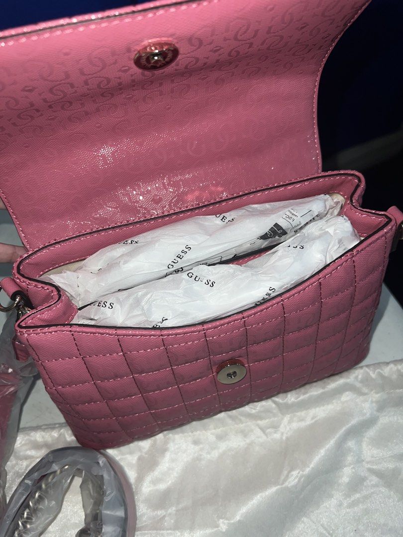 Guess Quilted Pink Handbag with Strap (Category: Luxury Bags & Wallets) located in Quezon City. Submitted by velmarae (Listing ID 1460374833, Image 3). Description: - Brand new pink Guess handbag with sling - with dust bag (has some stain BUT bag itself is in mint condition) - comes with guess tote bag - Versatile with top handle and detachable shoulder strap - Convenient back zipper pocket - Interior features Guess branded lining - Never used, p