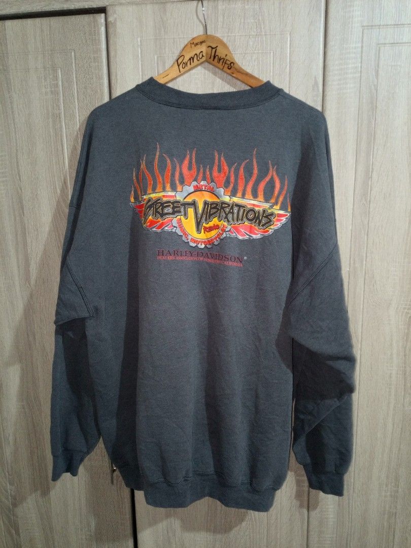 Harley-Davidson Street Vibrations Graphic Sweatshirt (Category: Coats, Jackets and Outerwear) located in Manila. Submitted by genitereym17524 (Listing ID 1460432797, Image 2). Description: -Vintage condition color rate 8-10 dimes w28 L29.7 Vintage Harley-Davidson Sweatshirt - Features 'Street Vibrations' graphic with flames on front and back - Brand: Port & Company - Estimated Size: 2XL or 2XT - Ideal for any Harley-Davidson fan.