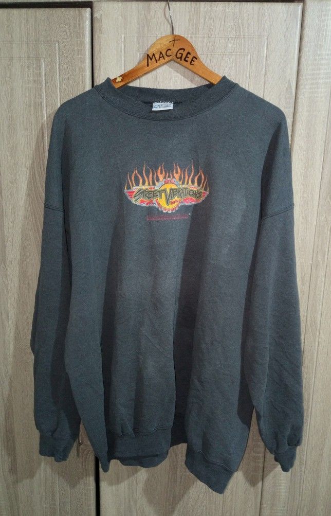 Harley-Davidson Street Vibrations Graphic Sweatshirt (Category: Coats, Jackets and Outerwear) located in Manila. Submitted by genitereym17524 (Listing ID 1460432797, Image 1). Description: -Vintage condition color rate 8-10 dimes w28 L29.7 Vintage Harley-Davidson Sweatshirt - Features 'Street Vibrations' graphic with flames on front and back - Brand: Port & Company - Estimated Size: 2XL or 2XT - Ideal for any Harley-Davidson fan.