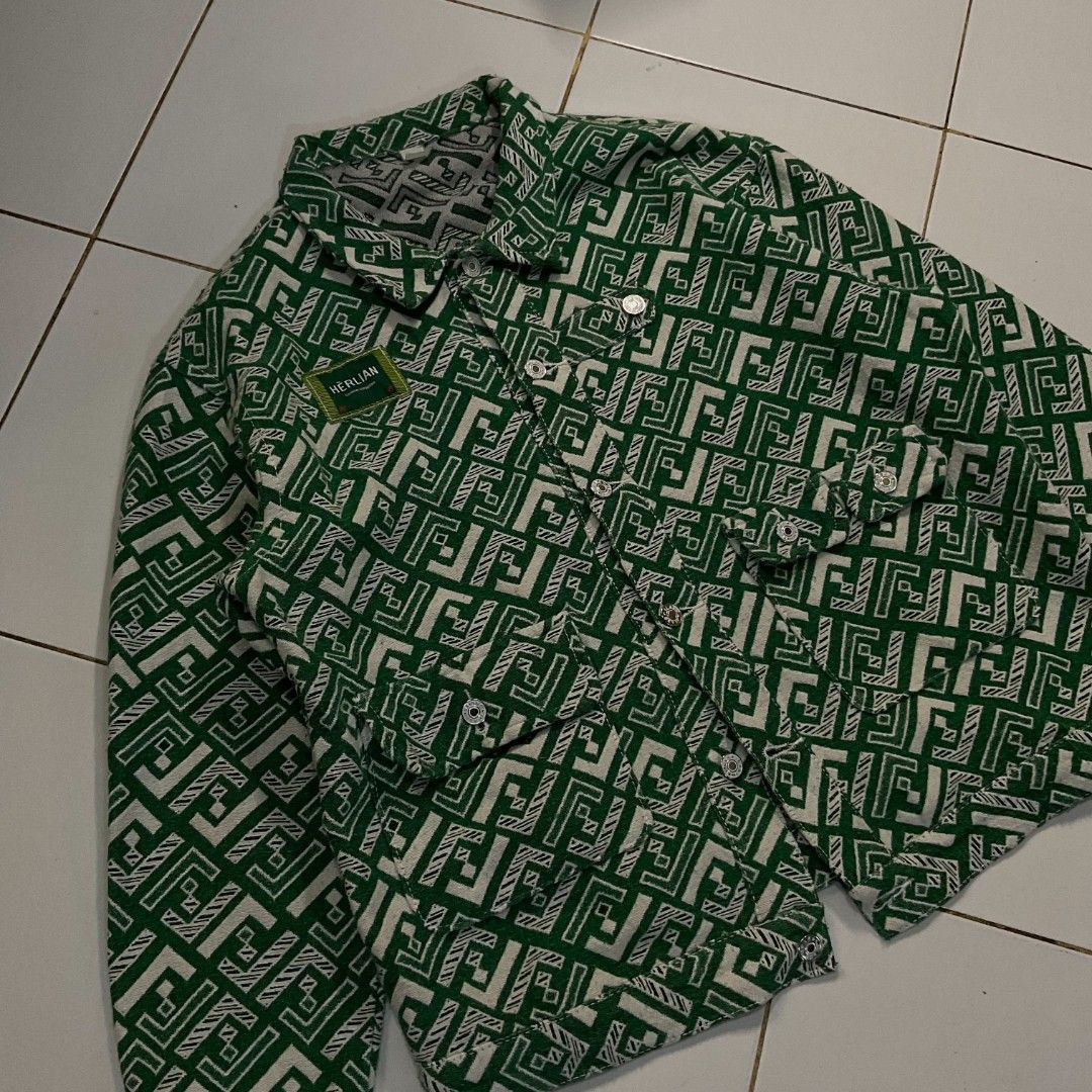 HERLIAN Green Geometric Pattern Button-Up Jacket (Category: Coats, Jackets and Outerwear) located in Morong. Submitted by rusty.vault (Listing ID 1460457167, Image 3). Description: - Stylish cool green jacket - Unique geometric pattern - HERLIAN brand patch on chest - Button-up front closure - Two chest pockets - Ideal for casual wear.