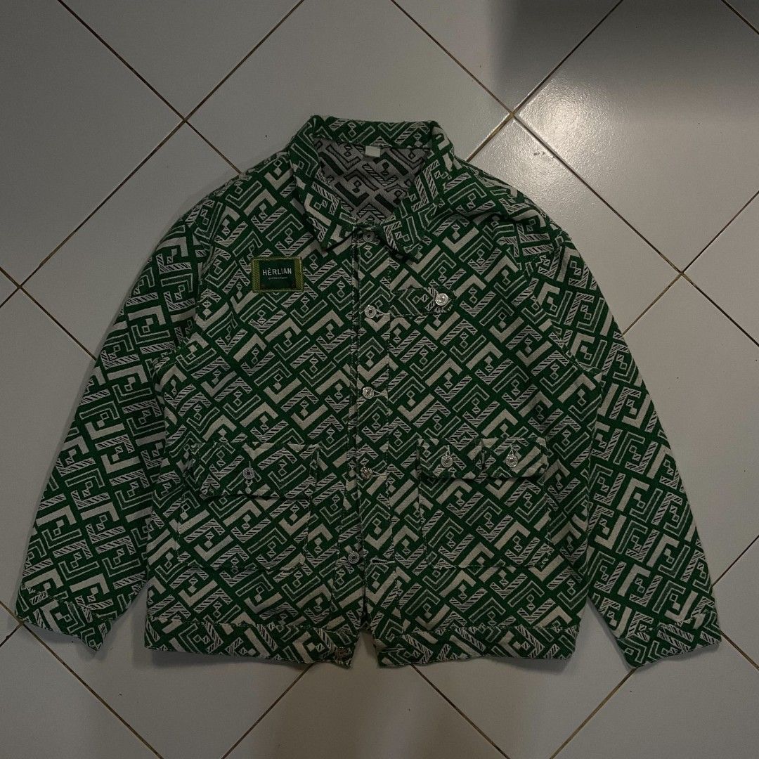 HERLIAN Green Geometric Pattern Button-Up Jacket (Category: Coats, Jackets and Outerwear) located in Morong. Submitted by rusty.vault (Listing ID 1460457167, Image 1). Description: - Stylish cool green jacket - Unique geometric pattern - HERLIAN brand patch on chest - Button-up front closure - Two chest pockets - Ideal for casual wear.