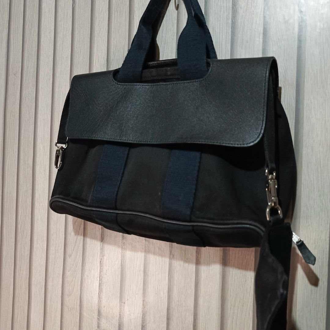 Hermes Black Canvas Leather Trim Tote Bag Pouch (Category: Luxury Bags & Wallets) located in Manila. Submitted by gbryanrave27905 (Listing ID 1460353045, Image 2). Description: HERMES TOIL SWIFT VALPARAISO BAG 📌 Elegant leather trim 📌 Comes with a matching pouch 📌 Authentic Hermes Paris logo on a metal button 📌 Two comfortable top handles 📌 Includes a detachable shoulder strap for versatility 📌 Ideal for everyday use or travel adventures 📌