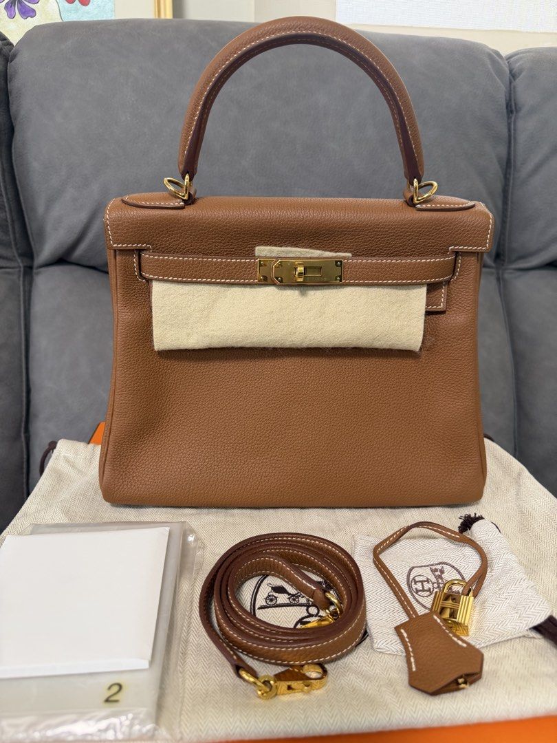 Hermes Kelly 28 Gold GHW (Category: Luxury Bags & Wallets) located in Mandaluyong City. Submitted by az.purse (Listing ID 1460440978, Image 1). Description: Stamp X Comes with box, dustbag, clochette and LG certificate.