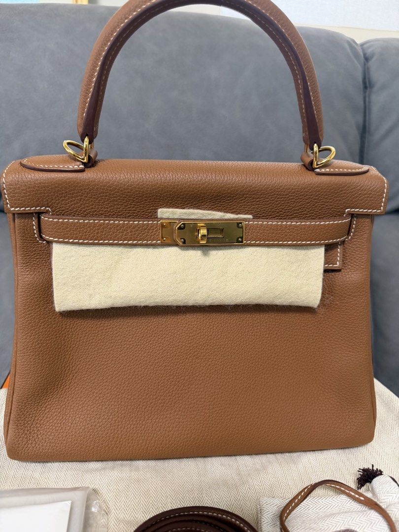 Hermes Kelly 28 Gold GHW (Category: Luxury Bags & Wallets) located in Mandaluyong City. Submitted by az.purse (Listing ID 1460440978, Image 2). Description: Stamp X Comes with box, dustbag, clochette and LG certificate.