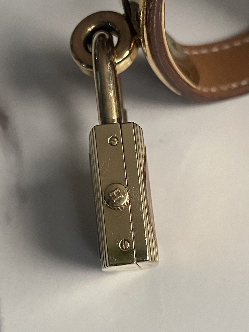 Hermes Paris "Kelly" Lock Watch (Category: Women's Watches) located in Taguig. Submitted by j_watches007 (Listing ID 1460318397, Image 3). Description: Authentic Secondhand ⌚ Hermes Paris Watch Swiss Made Quartz Serial Number: 796857 Plaque: 6 10 M Elegant Gold Tone Case with Lock Design Classic Brown Leather Strap Authentic Secondhand ⌚ “Watch Only” DISCLAIMER: IT’S OLD USED WATCHES EXPECT SOME SCRATCHES, SIGNS OF USED & PLEASE MANAGE YOUR EXPEC
