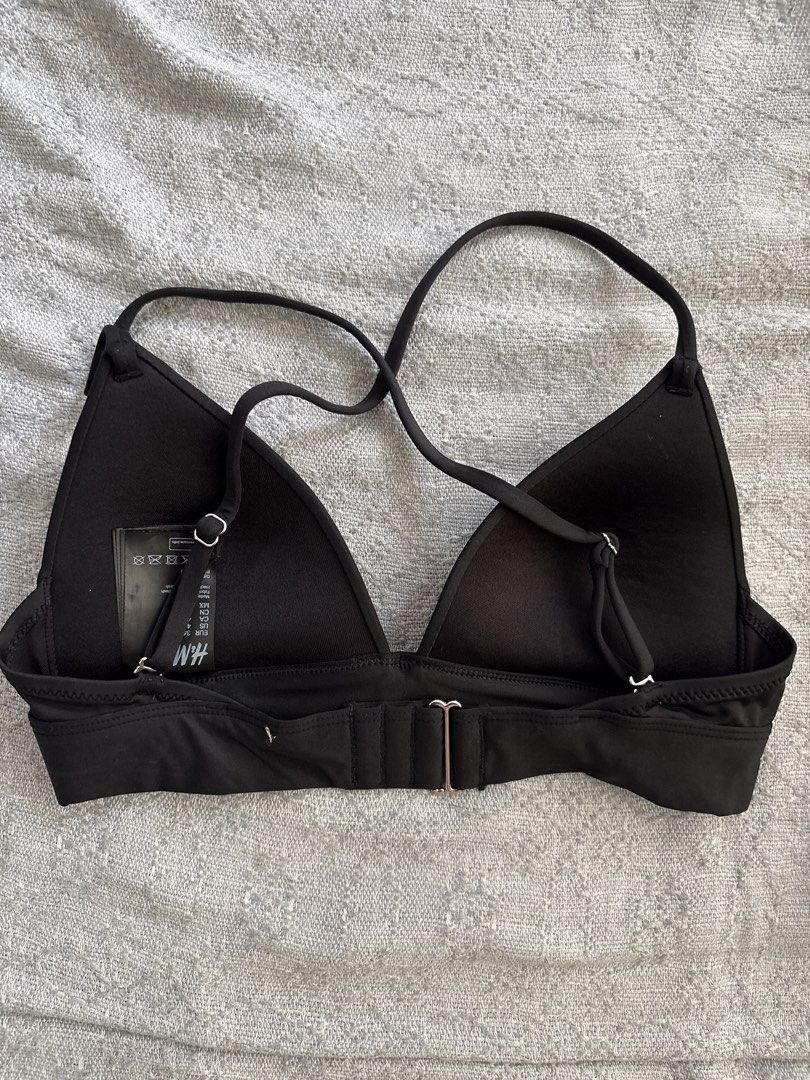 H&M Black Bikini Top (Category: Bikinis & Swimsuits) located in Mandaluyong City. Submitted by xxtin (Listing ID 1460312082, Image 2). Description: - Brand: H&M - Color: Black - Style: Triangle cup bikini top - Features: Criss-cross back straps, adjustable straps, clasp closure - Size: 4 US / 36 EUR.