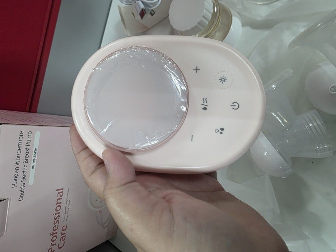 HORIGEN WONDERMORE BREASTPUMP (Category: Breastfeeding & Bottle Feeding) located in Manila. Submitted by yammm23 (Listing ID 1460368992, Image 3). Description: HORIGEN WONDERMORE In very good condition. First Owner. Looksnew since twice ko lang nagamit. Complete inclusions with box and free 17mm flange size. Unused 21mm and 25mm flange size. No issue and di ko pa natanggal ung plastic ng motor. Makinis pa and ready to use. PM for any inquiry. Loc
