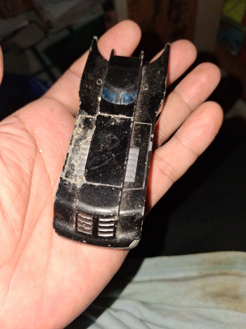 Hot Wheels Batman Batmobile Toy Car (Category: Vehicle & Diecast Models) located in Manila. Submitted by marcas022798212 (Listing ID 1460444915, Image 1). Description: - Classic Hot Wheels Batmobile toy car - Black die-cast metal construction - Shows some dust and wear from play, adding character - Wheels still roll smoothly - Ideal for any Batman fan's collection - Great for display or play.