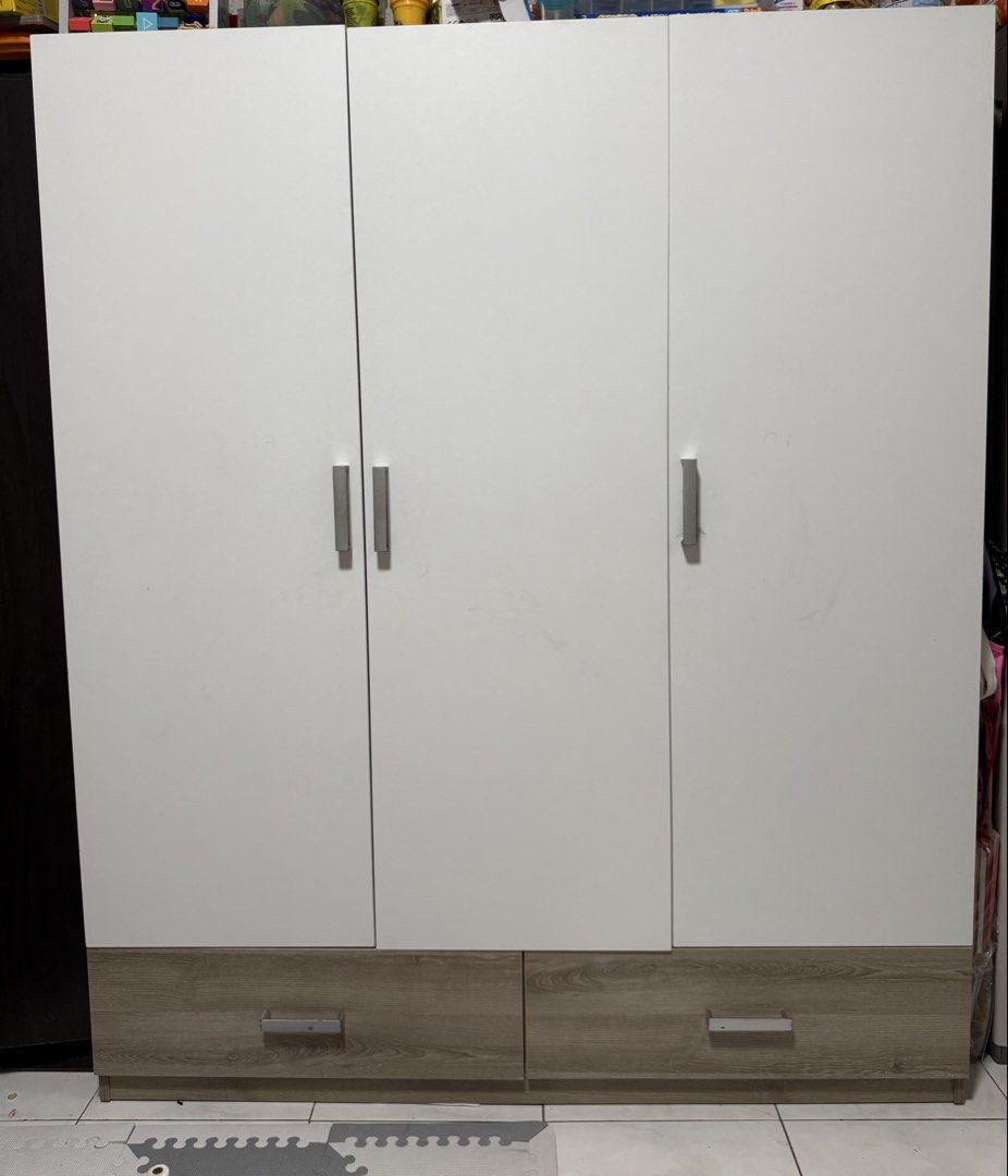 IKEA VASH 3-Door Wardrobe (Category: Shelves, Cabinets & Racks) located in Las Pinas. Submitted by tintinsant0s (Listing ID 1460460239, Image 1). Description: Bought at 14k Selling for only 9k Lightly used. Clean, minimalist, white + wood finish – This budget-friendly wardrobe features a two-tone design that adds a stylish touch to any bedroom. A spacious hanging area helps keep your living space tidy and clutter-free. – Constructed from high-gra