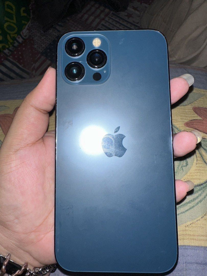 IPHONE 12 PRO MAX 128 GB BLUE (Category: iPhone 12 Series) located in Manila. Submitted by djanielle (Listing ID 1460343736, Image 1). Description: Iphone 12 pro max 128 gb 100% batt health (kakapalit lang, genuine parts) palit lcd pero premium oled no face ID due to ios update can do meetup around manila, ship nalang sa malayo smooth pa naman gamitin inclusions: charger and case 13K FIXED.