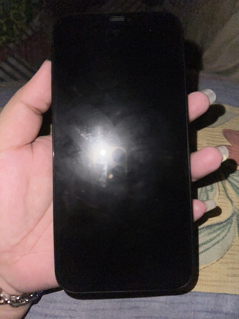 IPHONE 12 PRO MAX 128 GB BLUE (Category: iPhone 12 Series) located in Manila. Submitted by djanielle (Listing ID 1460343736, Image 2). Description: Iphone 12 pro max 128 gb 100% batt health (kakapalit lang, genuine parts) palit lcd pero premium oled no face ID due to ios update can do meetup around manila, ship nalang sa malayo smooth pa naman gamitin inclusions: charger and case 13K FIXED.
