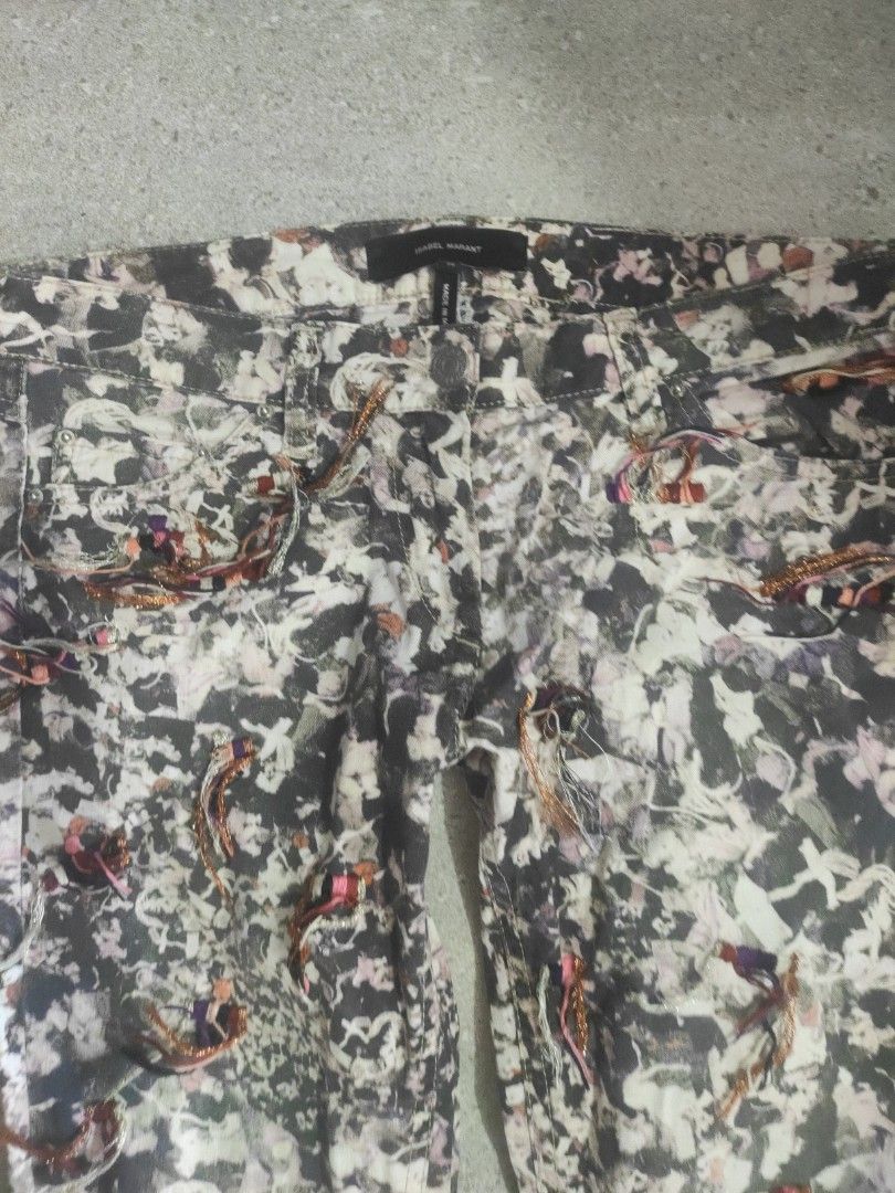 Isabel Marant Printed Pants (Category: Other Bottoms) located in Santa Rosa. Submitted by y2kstylist (Listing ID 1460383268, Image 2). Description: - Isabel Marant pants - Unique abstract print - Made in Morocco - Zip fly and button closure - Colors: Black, white, pink, red - Metallic thread details - Perfect statement piece size 30.