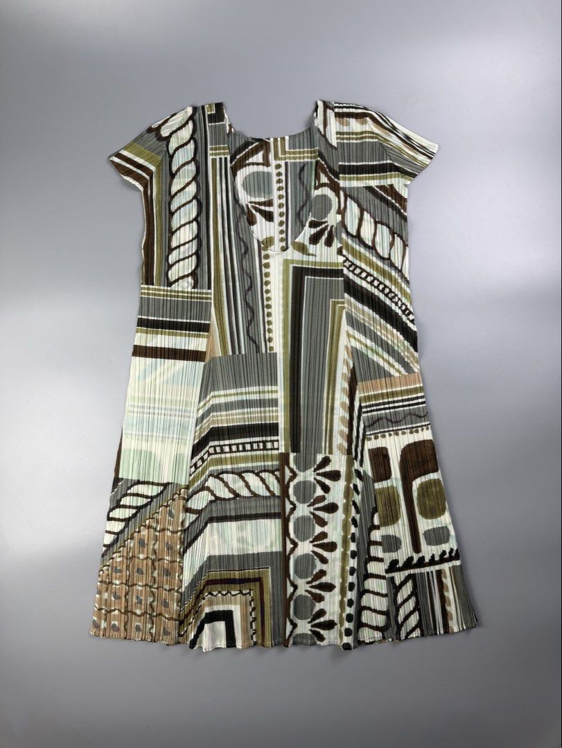 Issey Miyake - Pleats Please - Geometric Pattern Tunic Dress (Category: Dresses) located in Pasig City. Submitted by on_the_trend (Listing ID 1460485365, Image 1). Description: Tagged size: 4 Condition: 9.5/10 Material: 100% Polyester Made in: Japan Measurement: Width: 14.5 inches Shoulder: 9 inches Waist: 16 inches Length: 29.5 inches.