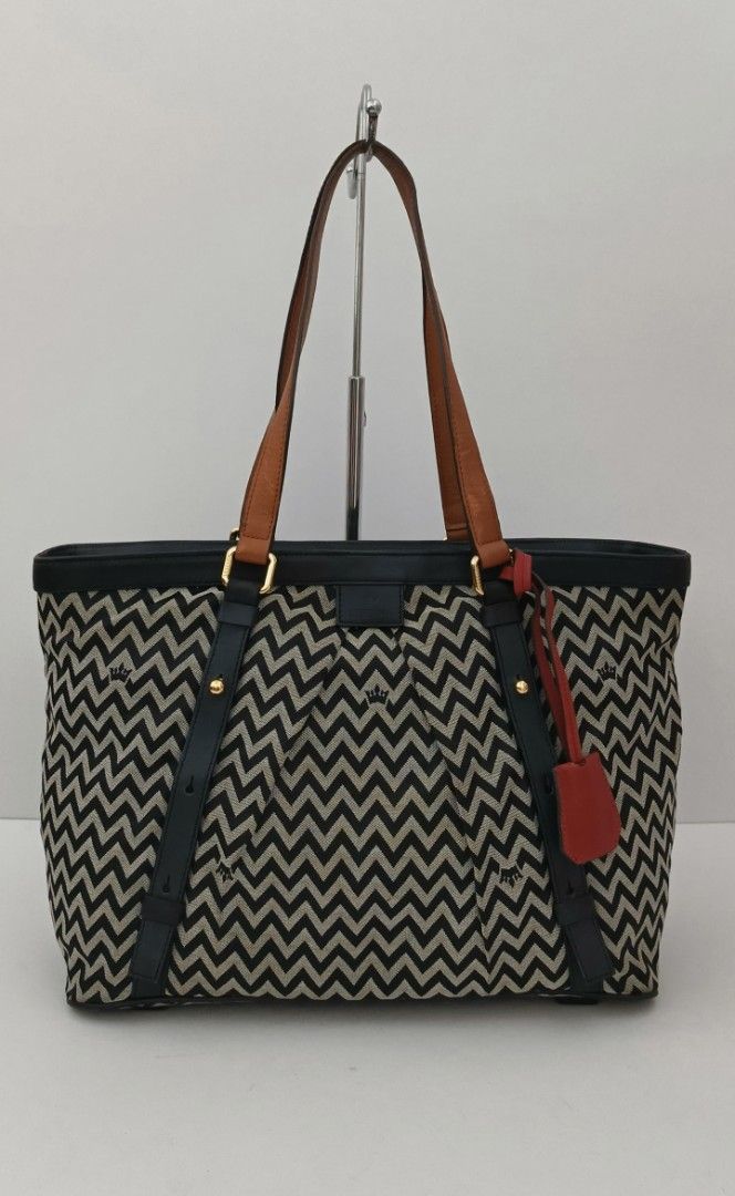 J. Estina Canvas & Leather tote (Category: Tote Bags) located in Kapalong. Submitted by ukaybagscurator (Listing ID 1460360796, Image 1). Description: size - 14x11x6 inches.