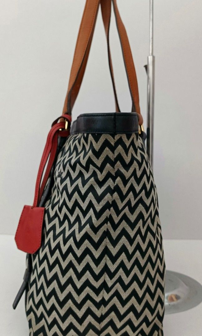 J. Estina Canvas & Leather tote (Category: Tote Bags) located in Kapalong. Submitted by ukaybagscurator (Listing ID 1460360796, Image 3). Description: size - 14x11x6 inches.