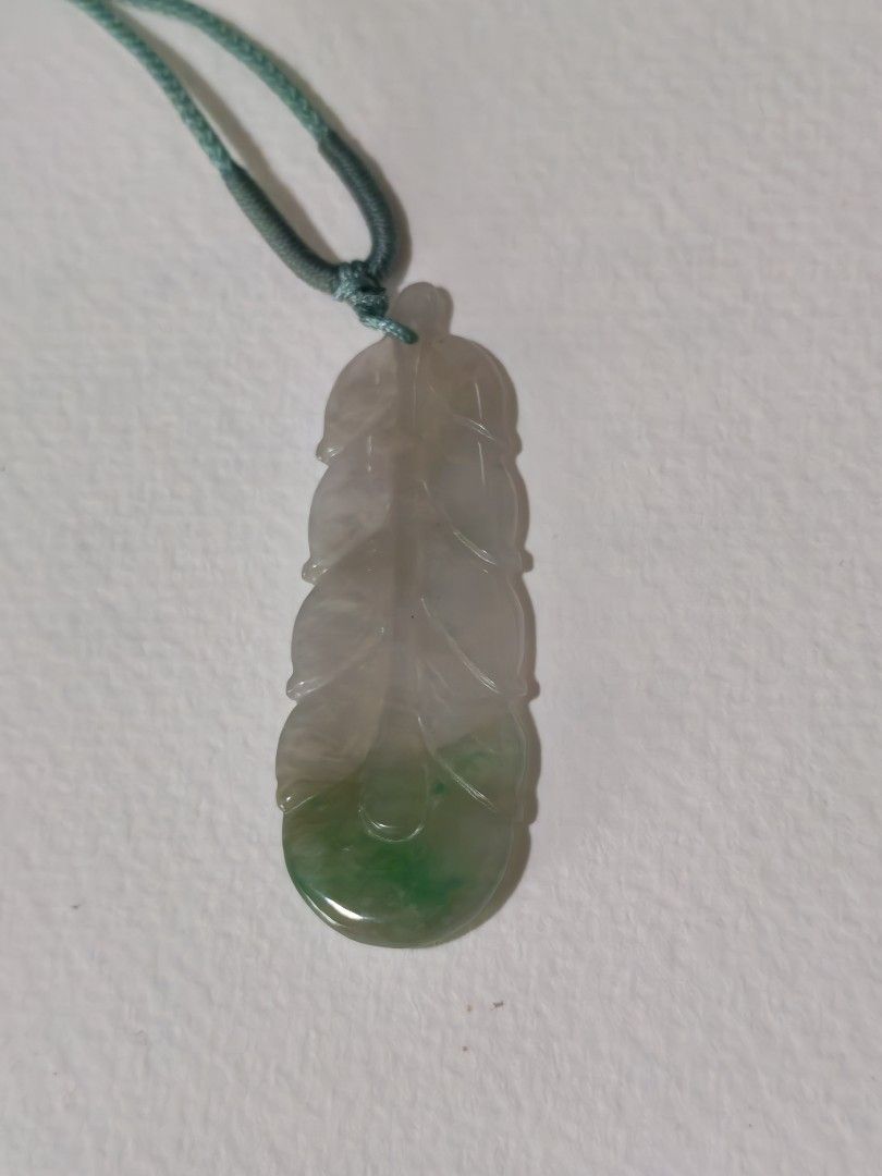 Jade pendant (Category: Luxury Accessories) located in Bacoor. Submitted by jadeitemaster (Listing ID 1460366665, Image 2). Description: Feather pendant natural jadeite With certificate, Have small cracks, and stone lines inclusion. Still good for daily wear. Polished, icy, with apple green. Type A Jadeite Only one! Please message if interested..