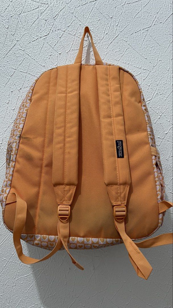 Jansport Backpack Orange Heart Pattern (Category: Backpacks) located in Naga. Submitted by lilycheedeclutter (Listing ID 1460488694, Image 2). Description: HAS STAIN bc of my dark denim pants but can be removed by washing Can fit 15” gaming laptop RFS: Too many bags Bought for 2.4k Used less than 20 times.
