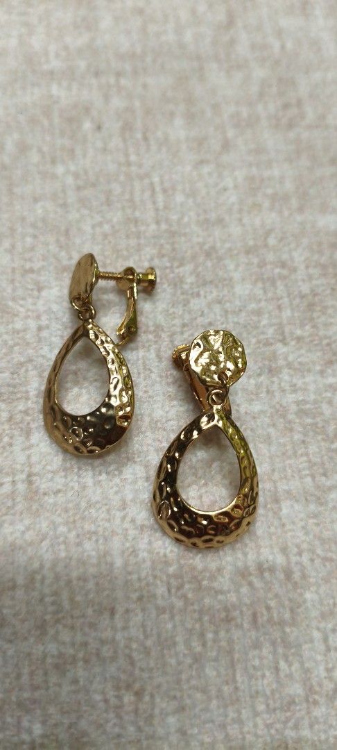 Japan Gold Teardrop Hammered Dangle Earrings (Category: Earrings) located in Quezon City. Submitted by gemaicloset (Listing ID 1460451288, Image 1). Description: - Elegant gold teardrop earrings - Unique hammered texture for a sophisticated look - Convenient clip-on style - Lightweight and comfortable for all-day wear - Adds a nice shine to elevate any outfit.